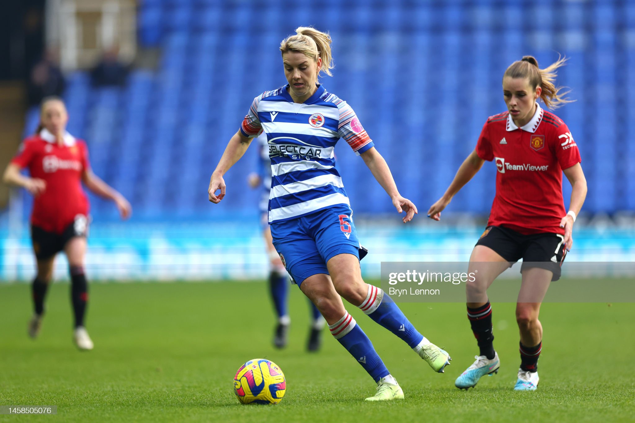 Gemma Evans of Reading runs with the ball whilst under pressure